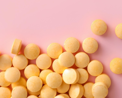 Close up view of orange-coated tablets